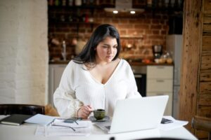 Woman researching on laptop